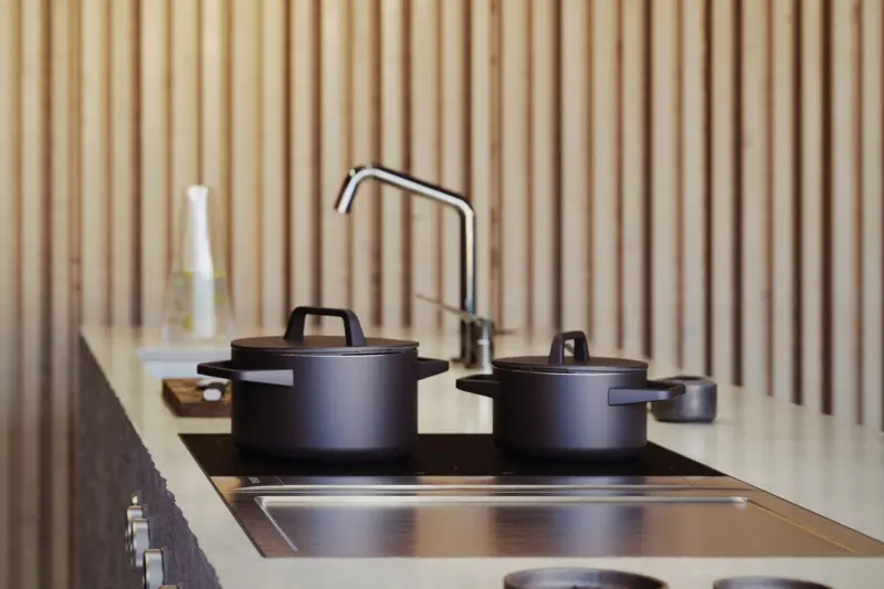 A BORA Professional 3.0 cooktop extractor with pans, in a pale wood kitchen