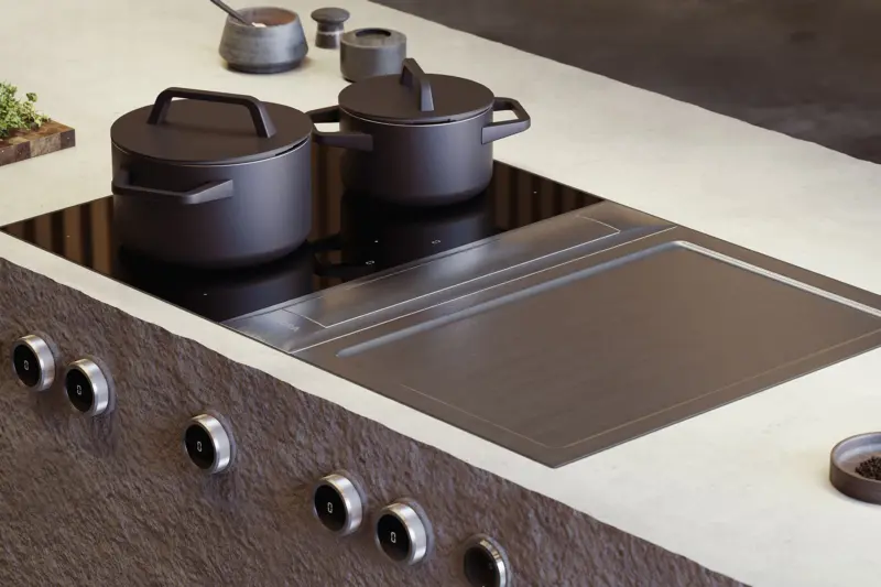 A BORA cooktop and Tepan grill set into a stone island