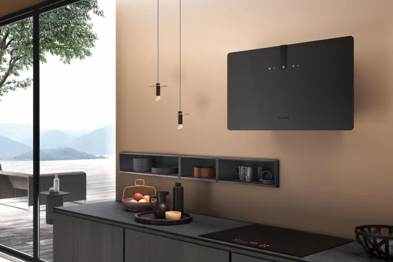 A black glass Faber cooker hood above an induction hob