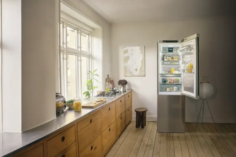 A stainless steel Liebherr fridge freezer in an oak kitchen